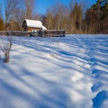 Kuti in deep meadow snow