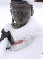 Buddha statue after a snow storm