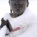 Buddha statue after a snow storm